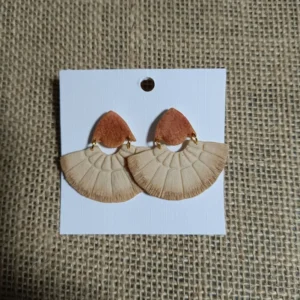 Handmade earrings featuring a beige fan design with a rust-colored top.