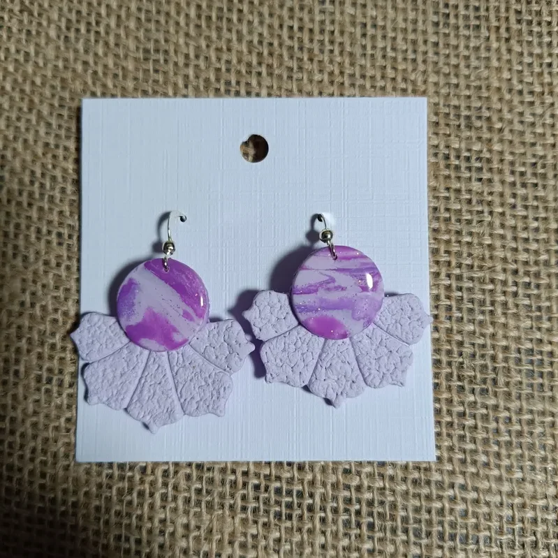Handmade lavender earrings with marbled cabochon and leaf design.