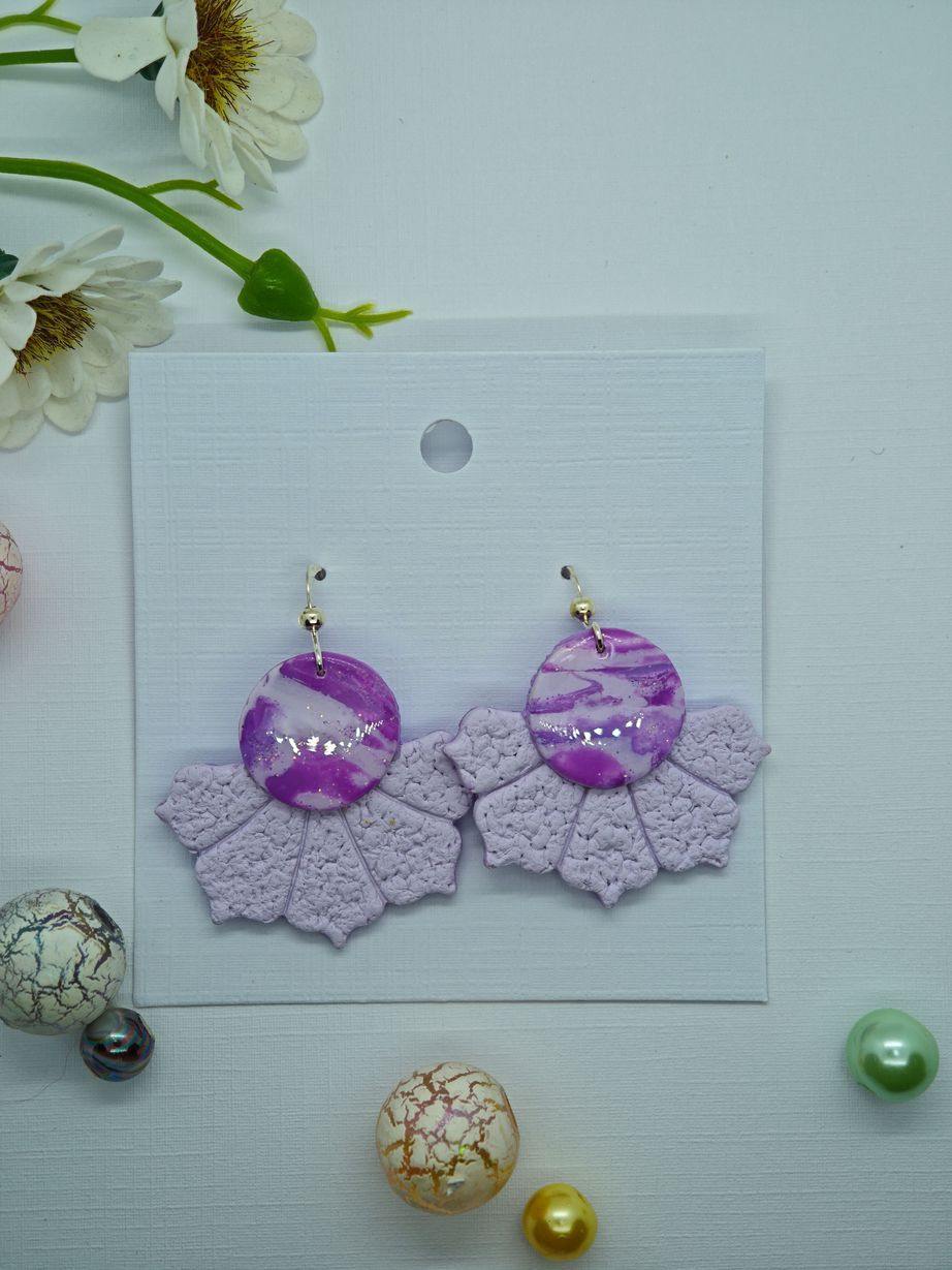 Handmade lavender earrings with marbled cabochon and textured petals.